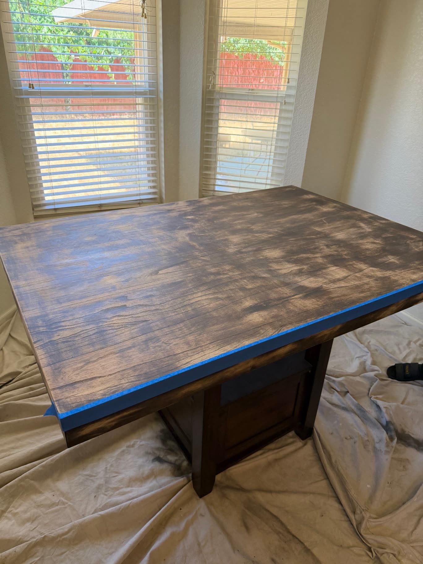 Sanded dining table top prepped in a home before an epoxy pour