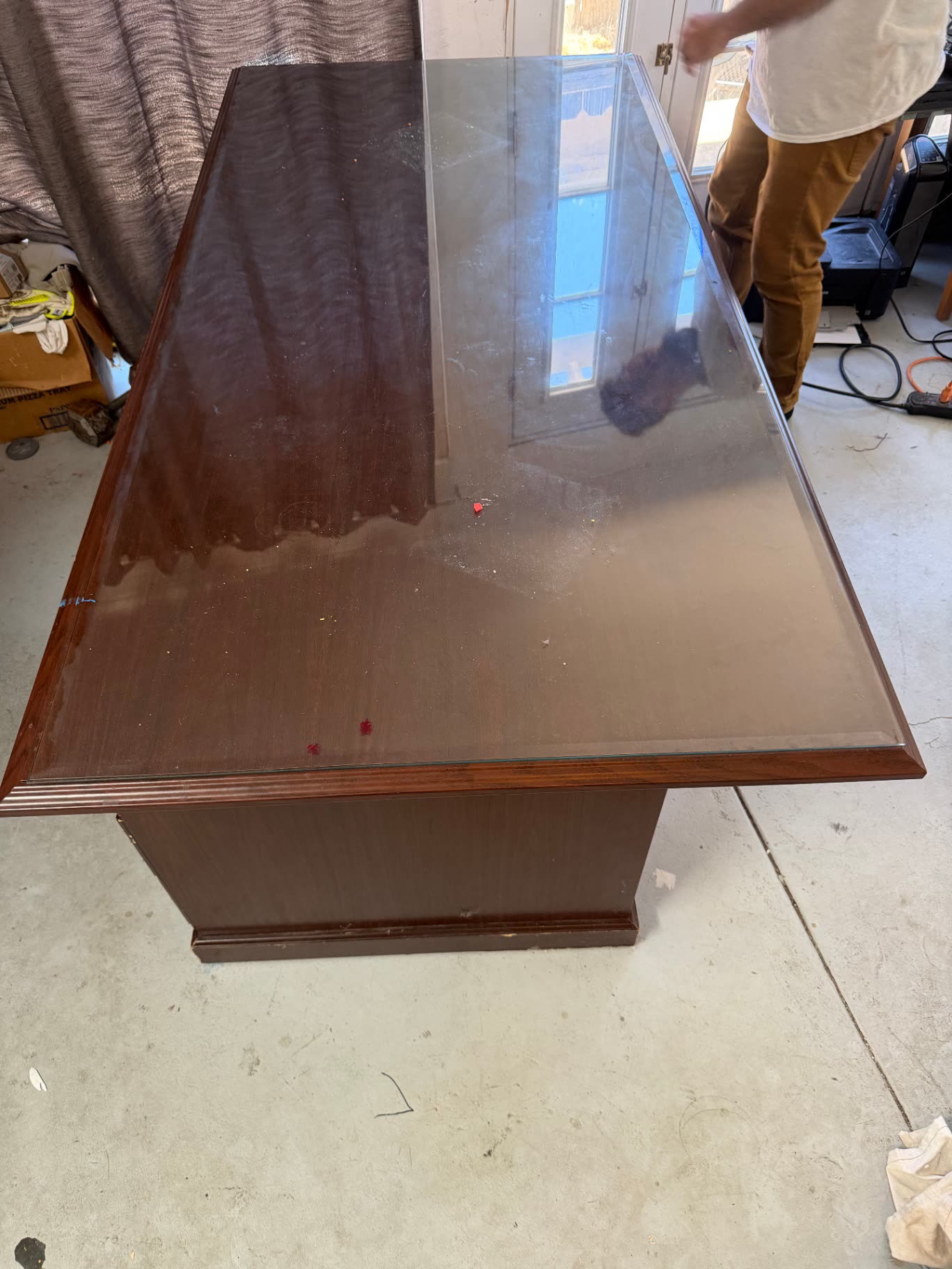 Dark wood executive desk with glass top before epoxy resurfacing