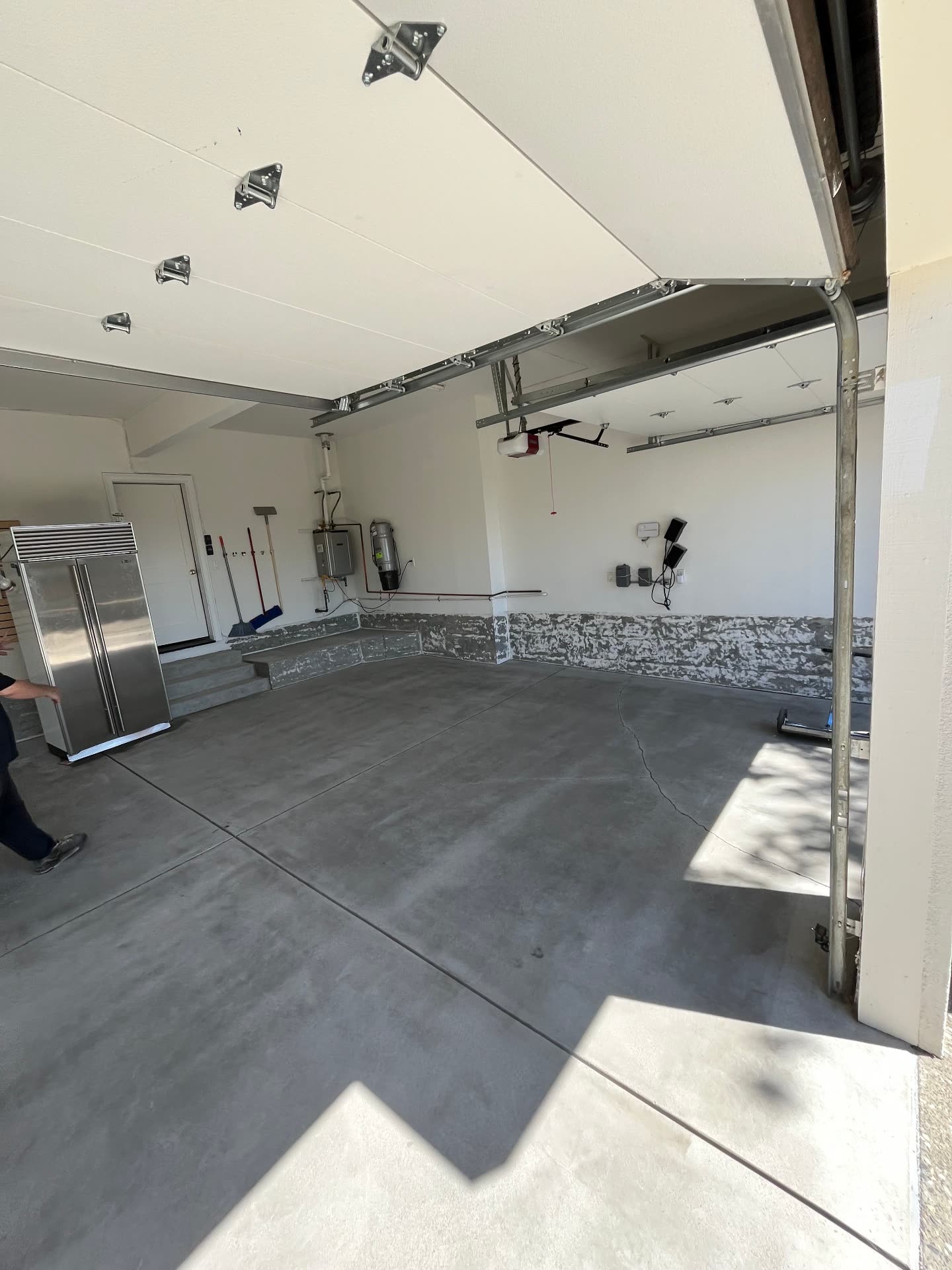 Garage with walls prepped and base coving in place before epoxy coating
